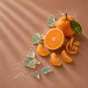 Whole and halved oranges, peeled orange segments, a spiraled orange peel, sea salt, and teal crystal pieces are artfully arranged on a brown surface with diagonal light and a leaf attached to one orange—capturing the fresh vibrance that inspires Enviroscent Stix Diffuser Air Freshener Refill for a clean, non-toxic scent experience.