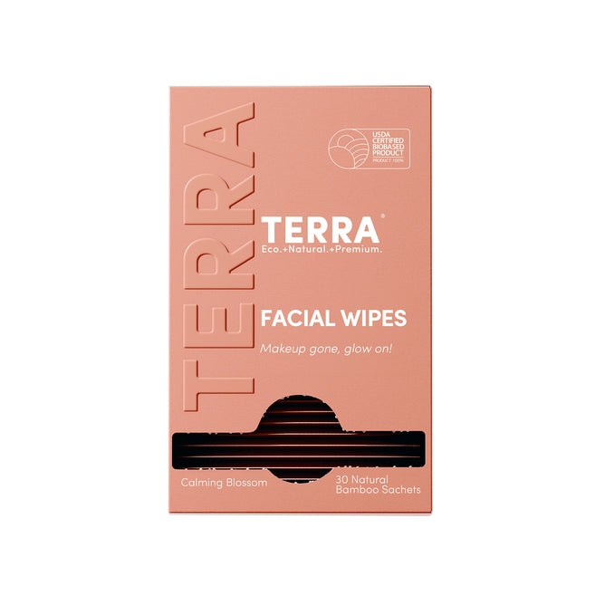 A peach Terra box of Micellar Water Facial and Makeup Removing Wipes with Aloe & Vitamin E, “Calming Blossom” scent, includes 30 natural bamboo sachets and shows the USDA certified biobased product logo. Individually wrapped.