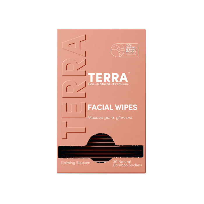A peach Terra box of Micellar Water Facial and Makeup Removing Wipes with Aloe & Vitamin E, “Calming Blossom” scent, includes 30 natural bamboo sachets and shows the USDA certified biobased product logo. Individually wrapped.