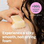 A person with wet hair uses a soapy bar on their shoulder. Text reads: ATTITUDE super leaves Body Soap Bar: +99% natural origin* (ISO 16128). Enjoy silky, non-drying foam from our vegan soap bar made with natural ingredients.
