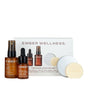 The Ember Wellness Face Starter Set includes two amber glass bottles (one Facial Oil, one dropper bottle), two round Serum Bars, and a white box with product details.