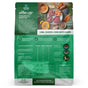 Back of a The Good List by Farmland Traditions bag shows Lamb, Venison & Bone Broth Recipe Food, Topper & Mixer for Dogs with images of raw lamb, venison, veggies, and herbs plus highlights on nutrition, premium ingredients, benefits, feeding guide and nutrients.