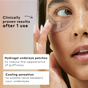 A woman applies The Good Patch De-Puff Hydrogel Undereye Patch beneath her right eye. Text reads “Clinically proven results after 1 use,” with notes about reducing under eye bags and a cooling, de-puffing sensation.