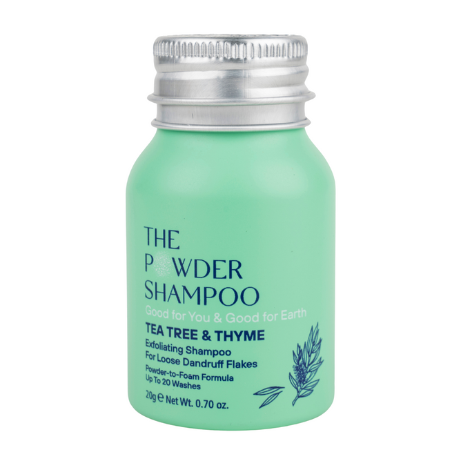 A small mint green bottle from The Powder Shampoo labeled Exfoliating Shampoo, with a silver cap, this anti-dandruff formula contains tea tree oil and thyme and transforms from powder to foam.