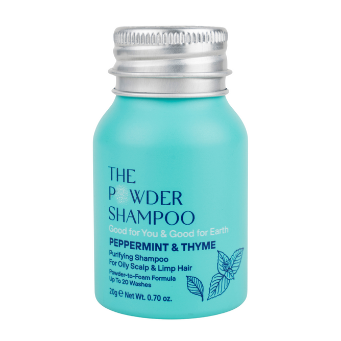 A turquoise bottle of The Powder Shampoo Purifying Shampoo, labeled Peppermint & Thyme, features peppermint oil for oily scalp and limp hair. With a silver cap and leaf designs, this sulfate-free formula refreshes and revitalizes.