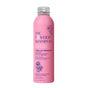 The Powder Shampoos pink cylindrical Hydrating & Replenishing Powder Shampoo, adorned with floral designs, emphasizes hydration and repair. Formulated with camellia and geranium, it is ideal for dry, fragile, or processed hair and transforms from powder to foam upon contact with water.