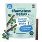 Shameless Pets The Tooth Berry Dental Stick is a grain-free dog treat with blueberries and mint, featuring immune support and upcycled ingredients. The package shows dental sticks for dogs surrounded by blueberries.
