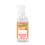 A clear plastic spray bottle of Rebel Green Tub & Tile Cleaner, featuring a peach label with green and red text, small illustrations, and a refreshing chamomile and orange blossom scent for cleaning bathroom stains.