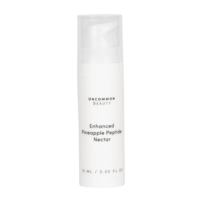 A white 15 ml bottle of Uncommon Beauty Enhanced Pineapple Peptide Nectar with a clear cap and minimalist black text—a serum formulated for radiant, youthful skin.