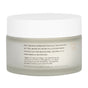 Uncommon Beauty Glycolic Pads come in a frosted glass skincare jar with a white lid. The label provides usage instructions—sweep a pad on face and neck after cleansing to help minimize pores—as well as safety info in black text.