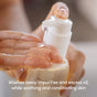 Close-up of a hand dispensing Uncommon Beauty Jelly Cleanser from a pump bottle onto fingers, with the text: This gentle, fragrance-free daily cleanser removes impurities and excess oil while soothing and conditioning your skin.