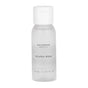A small, clear plastic bottle with a white cap labeled Uncommon Beauty Mini Micellar Water, 30 ml / 1.01 fl oz on the front; this gentle cleanser from Uncommon Beauty also works as an effective makeup remover.