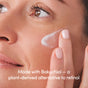 Someone applies Uncommon Beauty’s Retinol Alternative cream to their cheek. Text on image: Made with Bakuchiol—a gentle, plant-based alternative to retinol.