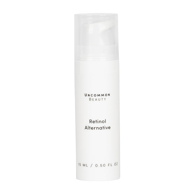 A white bottle of Uncommon Beauty Retinol Alternative, 15 ml (0.50 fl oz), with a clear cap sits against a white background, offering a gentle, anti-aging skincare solution.
