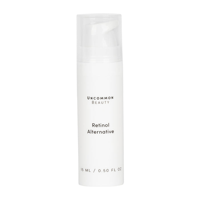 A white bottle of Uncommon Beauty Retinol Alternative, 15 ml (0.50 fl oz), with a clear cap sits against a white background, offering a gentle, anti-aging skincare solution.
