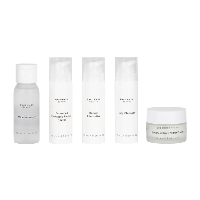 The Uncommon Beauty Daily Skincare Travel Set features five clean essentials—Micellar Water, Enhanced Pineapple Peptide Nectar, Retinol Alternative, Jelly Cleanser, and Enhanced Daily Water Cream—all in one convenient kit.