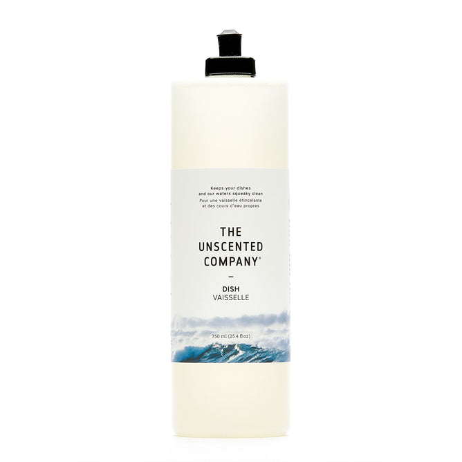 A 750 ml tall, clear bottle of The Unscented Company Dish Soap with a black flip-top cap and minimalist label featuring waves, containing vegan and fragrance-free dish soap.