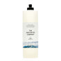 A 750 ml tall, clear bottle of The Unscented Company Dish Soap with a black flip-top cap and minimalist label featuring waves, containing vegan and fragrance-free dish soap.