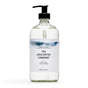 A clear pump bottle of The Unscented Company Hand Soap, with a minimalist label and mountain design, indicates it's unscented, vegan, and contains 465 mL (15.7 fl oz) of soap.