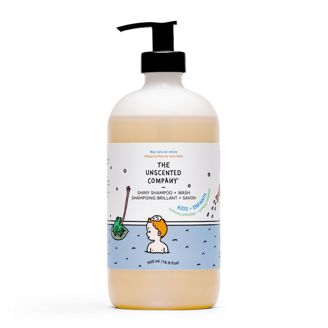 The Unscented Company Kids Shiny Shampoo comes in a clear pump bottle with a blue label, featuring a cartoon child showering; its gentle, hypoallergenic formula is designed for kids and enriched with natural ingredients.