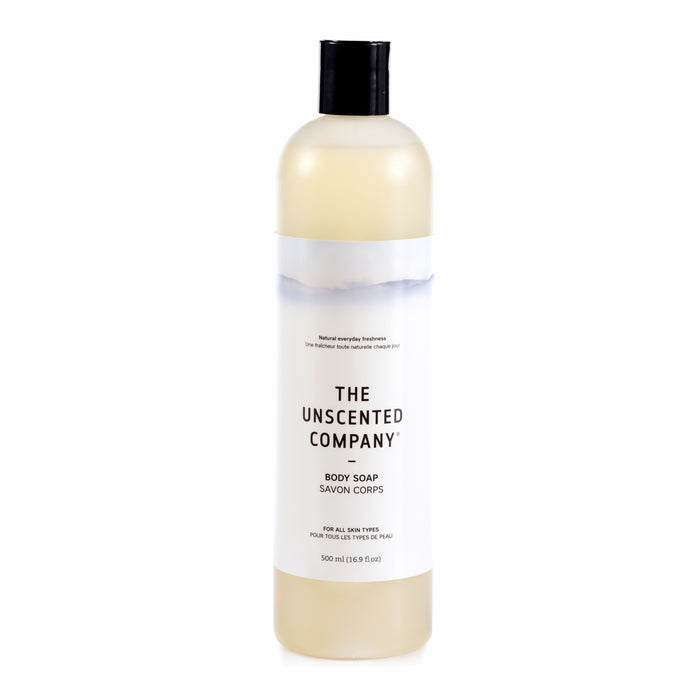 A 500 ml clear plastic bottle of The Unscented Company Body Soap with a black flip-top cap, minimalist white label, and gray text. This natural, gentle formula is ideal for daily use.