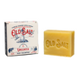 A rectangular bar of Old Salt Hair/Beard Shampoo, embossed with the brand name, sits beside its box featuring a lighthouse design and blue and red branding details. The unscented bar is ideal for hair and beard care.