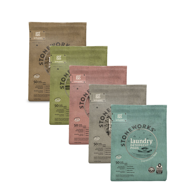 Five pastel Stoneworks Laundry Pods - Variety Pack (Coming Soon!) by grab green are arranged in a staggered row, each in a different color and featuring the Stoneworks logo plus nature-inspired names like Birch Branch and Oak Tree.