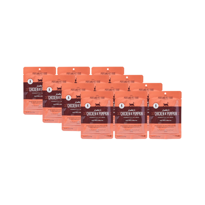 Six orange pouches of Lukes Chicken N Pumpkin Homestyle Wet Puree Cat Food Meal by Portland Pet Food Company are arranged in two staggered rows against a white background. The human-grade, grain-free packaging features cat graphics and product info.