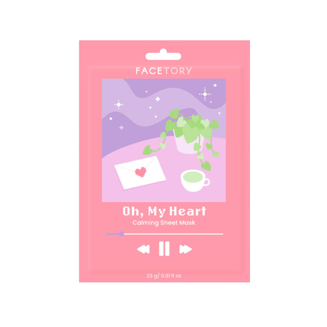 The FaceTory Oh, My Heart Calming Face Sheet Mask for sensitive skin comes in a pink packet with plant, cup, and letter illustrations on a starry purple background styled like album art.