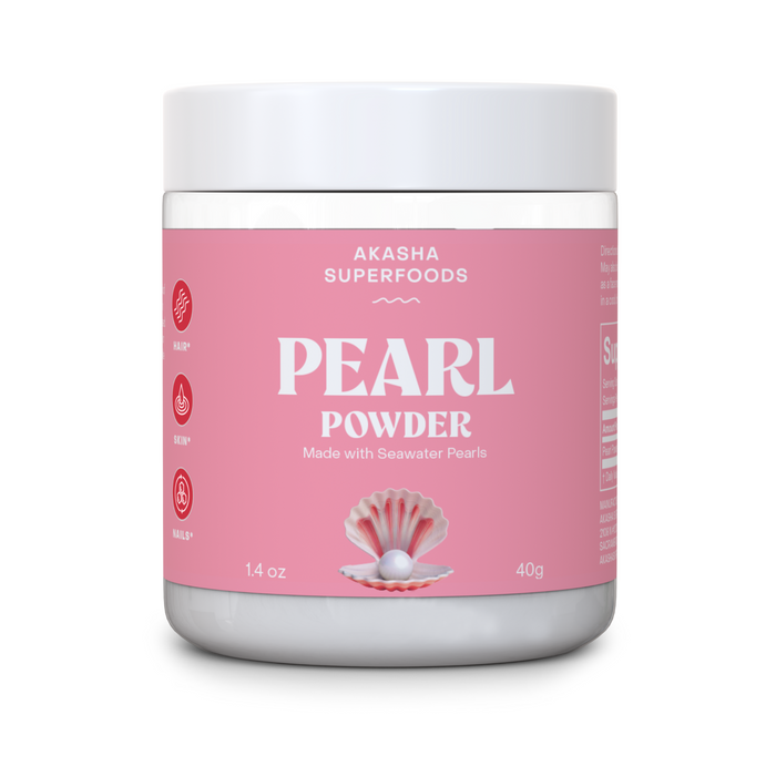 A white jar of Akasha Superfoods Pearl Powder with a pink label, open oyster and pearl graphic, and icons for benefits. Label notes “Made with Seawater Pearls,” 1.4 oz (40g). A self-care skincare essential.