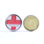 Two small tins of Little Seed Farm’s Hand-Aid Healing Hand Balm are shown: one closed with its label and one open to reveal the pale yellow balm inside—ideal for soothing dry, cracked hands.