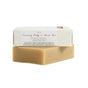 A beige cleansing bar sits beneath a white box labeled Little Seed Farm Milk (Unscented) Bar—perfect for sensitive skin, free of artificial and synthetic ingredients.