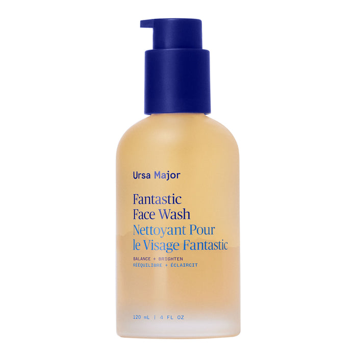A clear 120 ml (4 fl oz) bottle of Ursa Major Fantastic Face Wash with a blue pump and blue/yellow label, offering gentle exfoliation for daily cleansing and smooth skin.