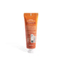 A 1.5 oz orange tube of VOESH Pumpkin Pie Vegan Hand Crème, featuring pumpkin extract and allergen-free fragrance, stands upright with its back label and product info visible on a white background.