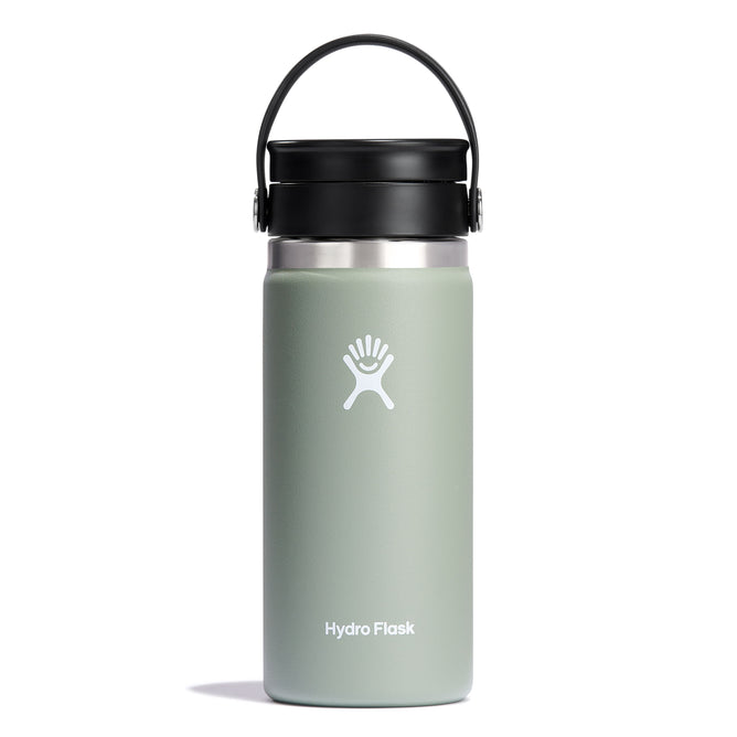 A 16 oz Wide Mouth Hydro Flask with black Flex Sip Lid™ features the logo in white on a light green bottle. Made for coffee and tea, it has TempShield double-wall vacuum insulation to keep drinks hot. The lid is securely attached, and the bottle stands upright against a plain white background.