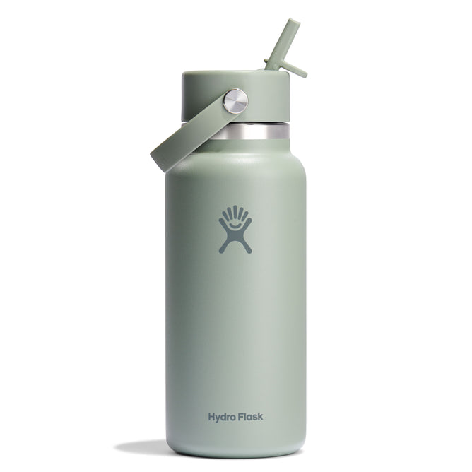 The 32 oz Hydro Flask Wide Mouth Bottle, in light green, boasts double-wall insulation and a leakproof Flex Straw Cap, complete with a carrying handle. The brands logo is prominently displayed on the front against a plain white background.