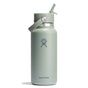 The 32 oz Hydro Flask Wide Mouth Bottle, in light green, boasts double-wall insulation and a leakproof Flex Straw Cap, complete with a carrying handle. The brands logo is prominently displayed on the front against a plain white background.