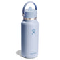 A 32 oz light blue Hydro Flask Wide Mouth Bottle with Flex Straw Cap, featuring a leakproof cap and handle on the lid. It has a metal band near the top and a logo in the center. Double-wall insulation keeps your drink cool, with the bottle casting a soft shadow on a white background.