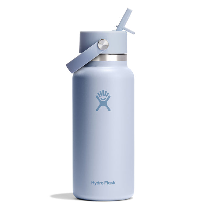 The 32 oz Hydro Flask Wide Mouth Bottle features a leakproof Flex Straw Cap with a flip lid and an easy-to-carry handle. The light blue bottle has double-wall insulation, smooth texture, and the Hydro Flask logo with text on the front.