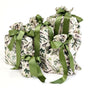 The Set of 5 Reusable Gift Bags - Natural Noel Birdlife by Waste Free Celebrations features cotton bags with green satin ribbons and bird-and-branch prints—a sustainable, thoughtful choice for gifting.