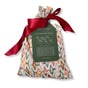 A set of 10 reusable gift bags by Waste Free Celebrations, Nutcracker Harlekin design: colorful geometric patterns, red satin drawstrings, and a dark green label—an eco-friendly alternative for sustainable gift wrap.