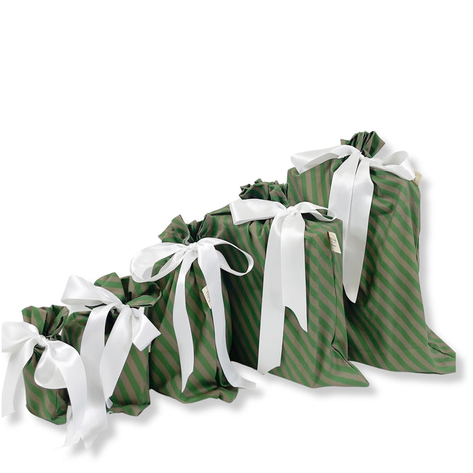 The Set of 5 Reusable Gift Bags - Green Stripes by Waste Free Celebrations features green striped bags in various sizes, stylishly arranged from smallest to largest—a chic and sustainable gift wrap choice.