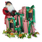 Create a festive scene with a Santa figurine next to gifts packed in Waste Free Celebrations Set of 5 Reusable Gift Bags – Traditional Stripes, decorated with dried orange slices and greenery for a sustainable touch.