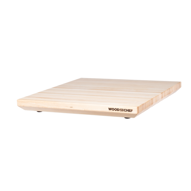 The Alto Raised Wood Board by WoodForChef is a rectangular maple board with a light finish, visible grain, small non-slip round feet, and the brand logo on one side. Made from 100% FSC Certified Maple Wood. Plain white background.
