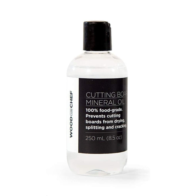 A clear plastic bottle with a black cap, labeled WoodForChef Food Grade Mineral Oil for Wood Cutting Board. The 250 mL (8.5 oz) label notes it’s food-grade and helps prevent wood drying and cracking.