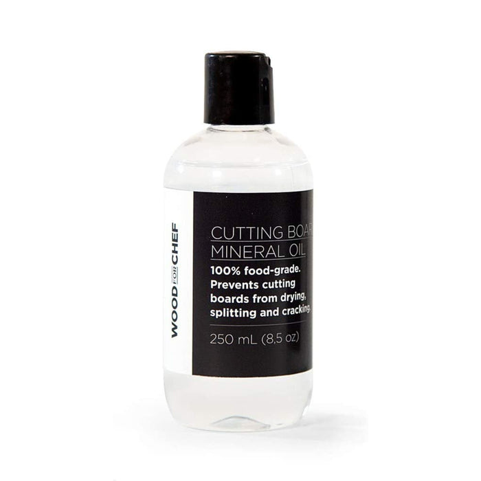 A clear plastic bottle with a black cap, labeled WoodForChef Food Grade Mineral Oil for Wood Cutting Board. The 250 mL (8.5 oz) label notes it’s food-grade and helps prevent wood drying and cracking.