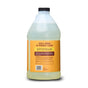 Aunt Fannie's Hardwood Floor Cleaner, Value Size, comes in a large clear jug with a black cap and an orange label on the back listing ingredients with essential oils, usage instructions, and recycling info. The light yellow liquid is visible inside.