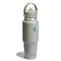 The wide mouth travel bottle, 32 oz, in sage green has a lid with a handle and features the Hydro Flask logo. Its sleek insulated design stands upright against a white background.