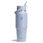 A 32 oz light blue Hydro Flask Wide Mouth Travel Bottle with Flex Straw Cap features the brand logo and a lid with a carrying handle, casting a subtle shadow on a white background.