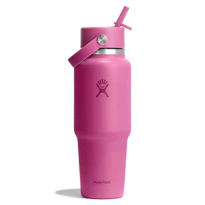 The Hydro Flask Wide Mouth Travel Bottle, 32 oz, in pink, includes a flex straw cap and handle on the lid. It features a simple logo on the front for style and functionality during your daily adventures.
